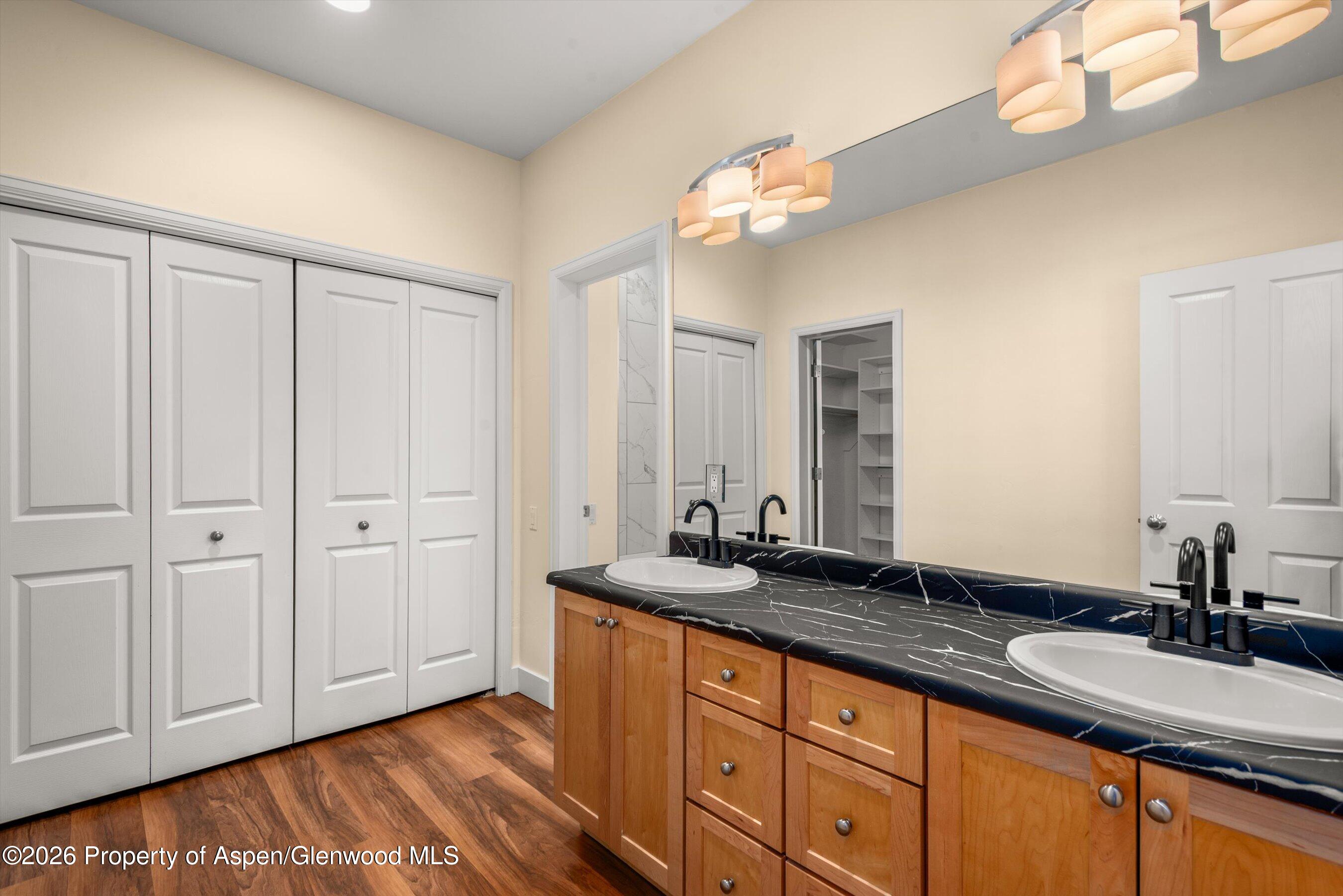 548 Evans Court Basalt, CO 81621 - Photo 26 of 36 a bathroom with a sink and a mirror