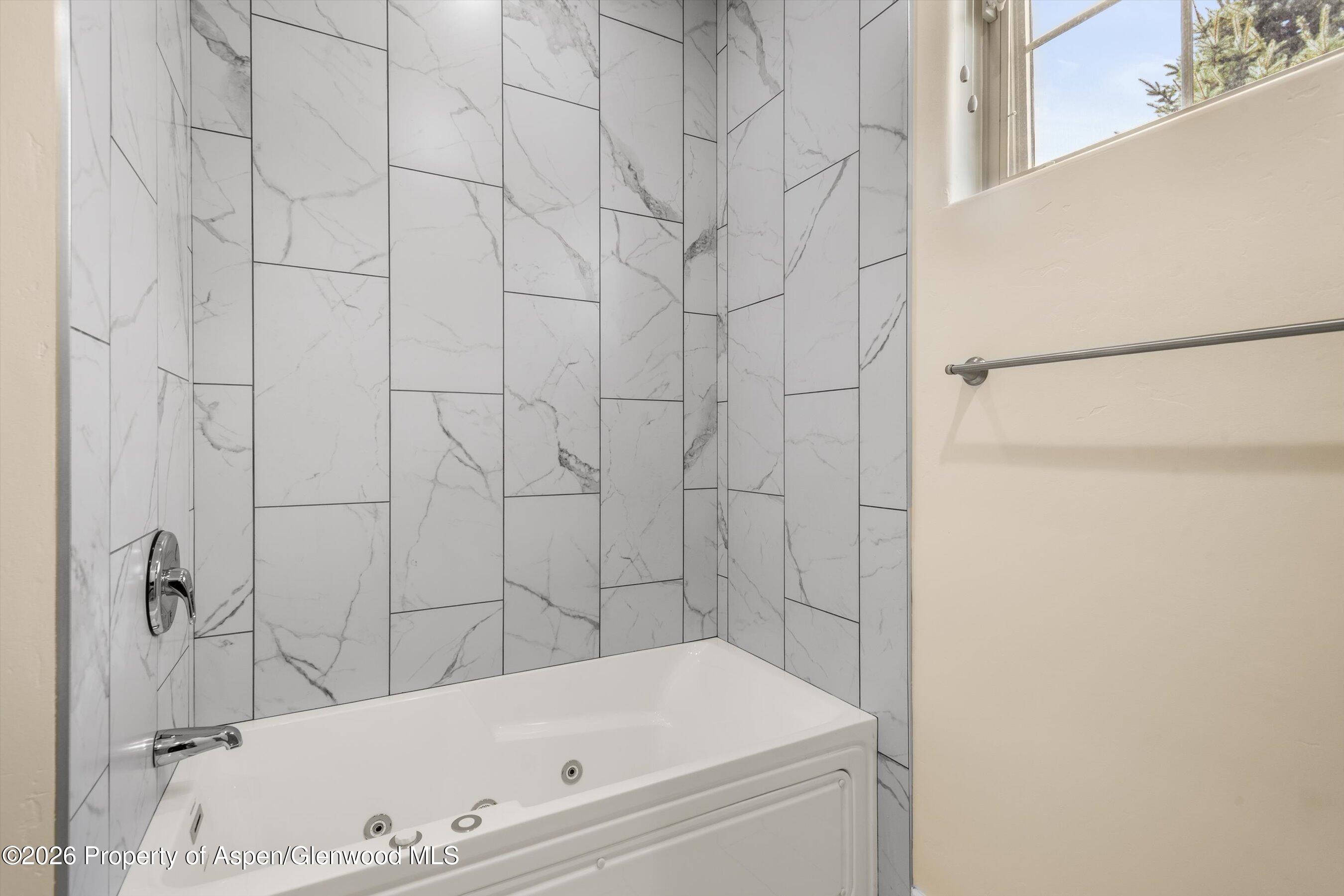 548 Evans Court Basalt, CO 81621 - Photo 29 of 36 a bathroom with a bathtub