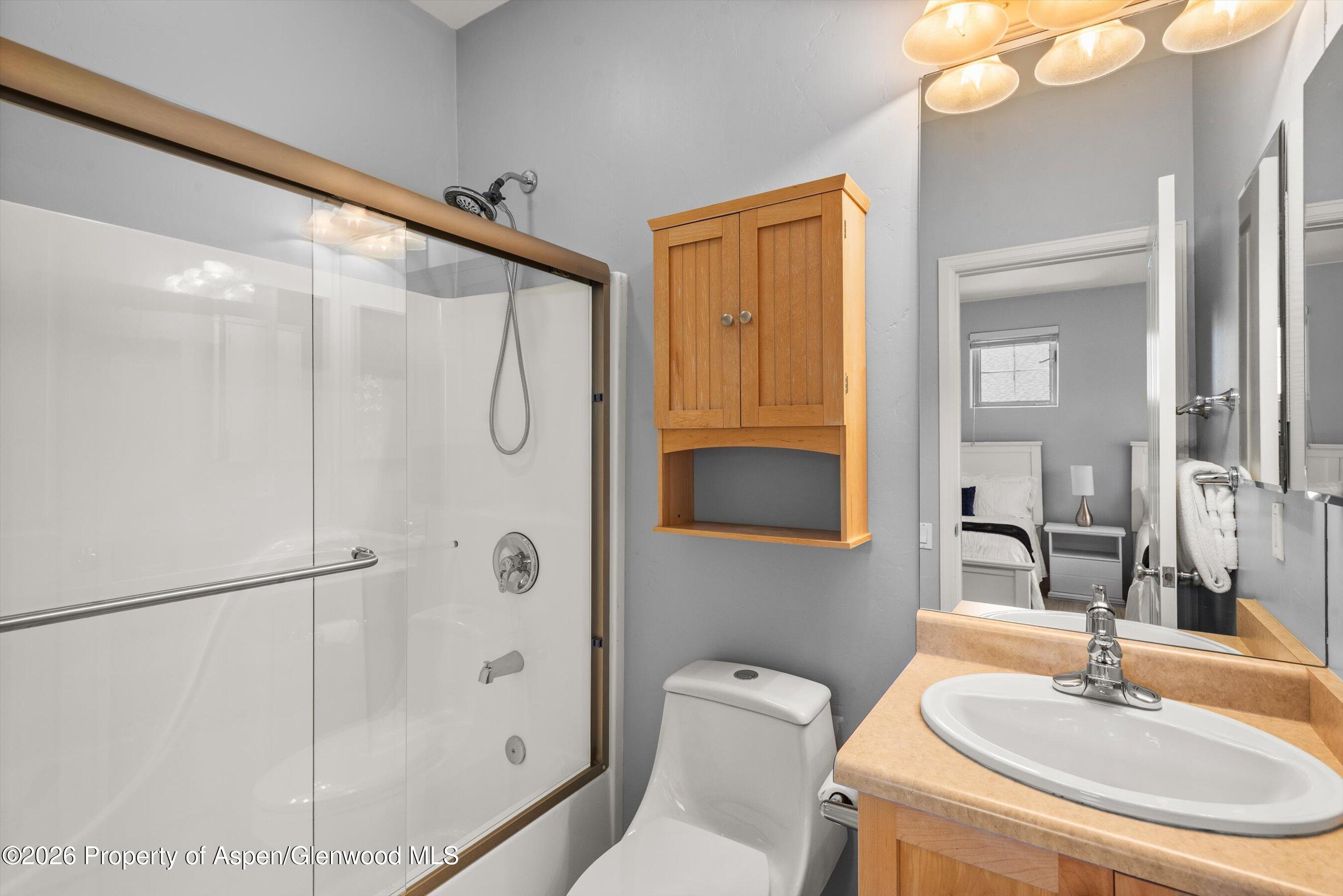 548 Evans Court Basalt, CO 81621 - Photo 32 of 36 a bathroom with a sink toilet and shower