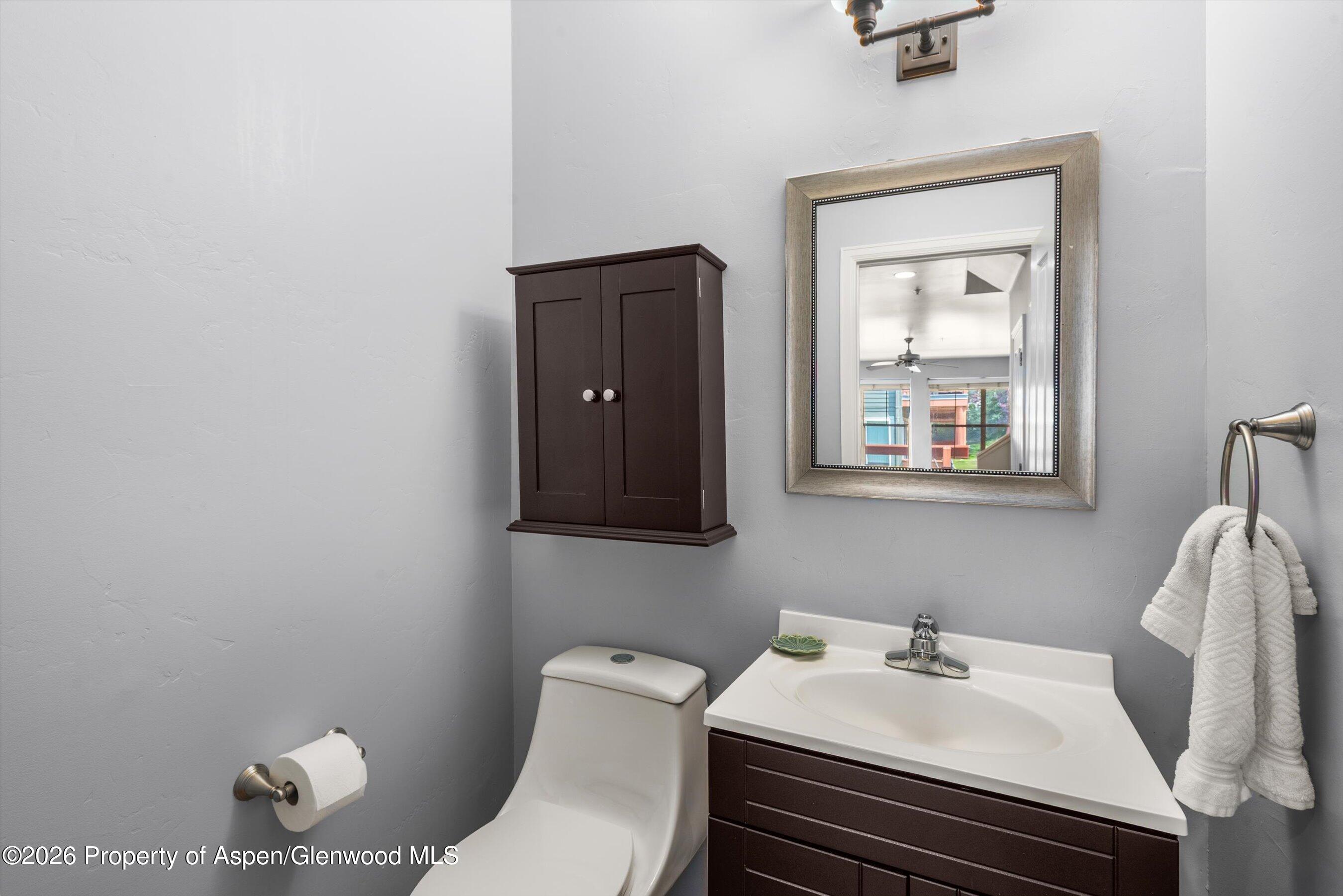 548 Evans Court Basalt, CO 81621 - Photo 36 of 36 a bathroom with a sink toilet and vanity