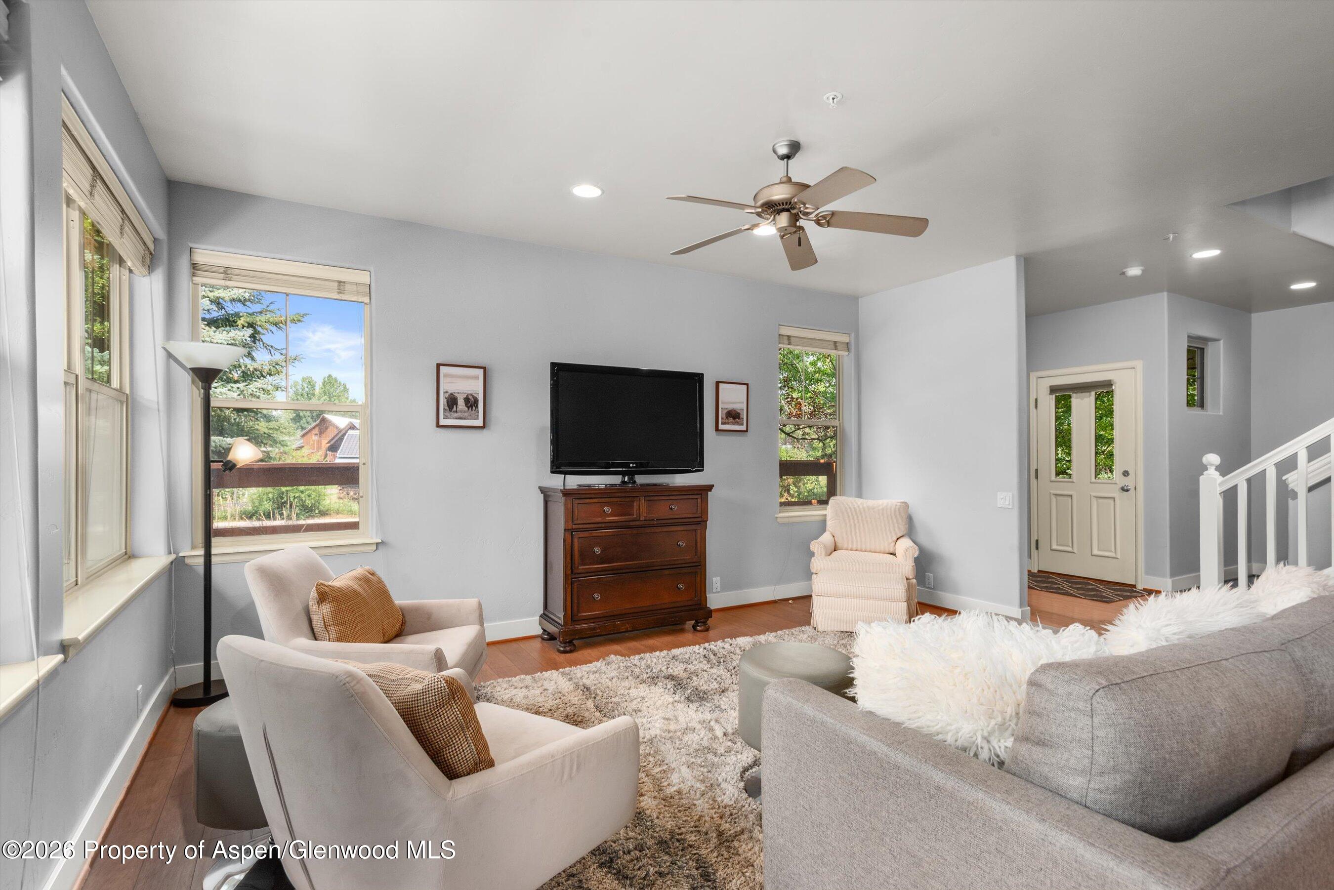 548 Evans Court Basalt, CO 81621 - Photo 4 of 36 a living room with furniture and a flat screen tv