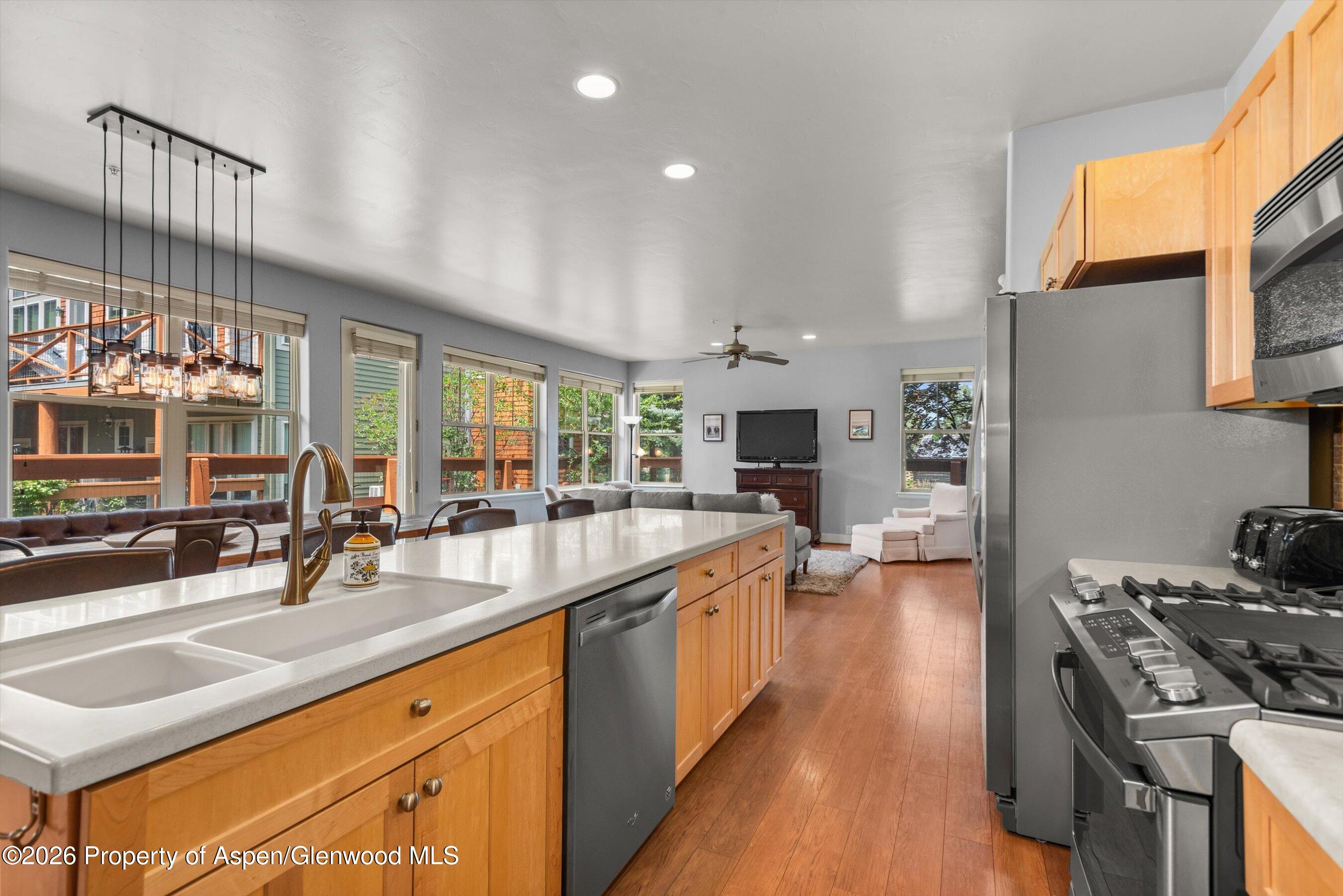 548 Evans Court Basalt, CO 81621 - Photo 6 of 36 a kitchen with stainless steel appliances a sink stove and cabinets