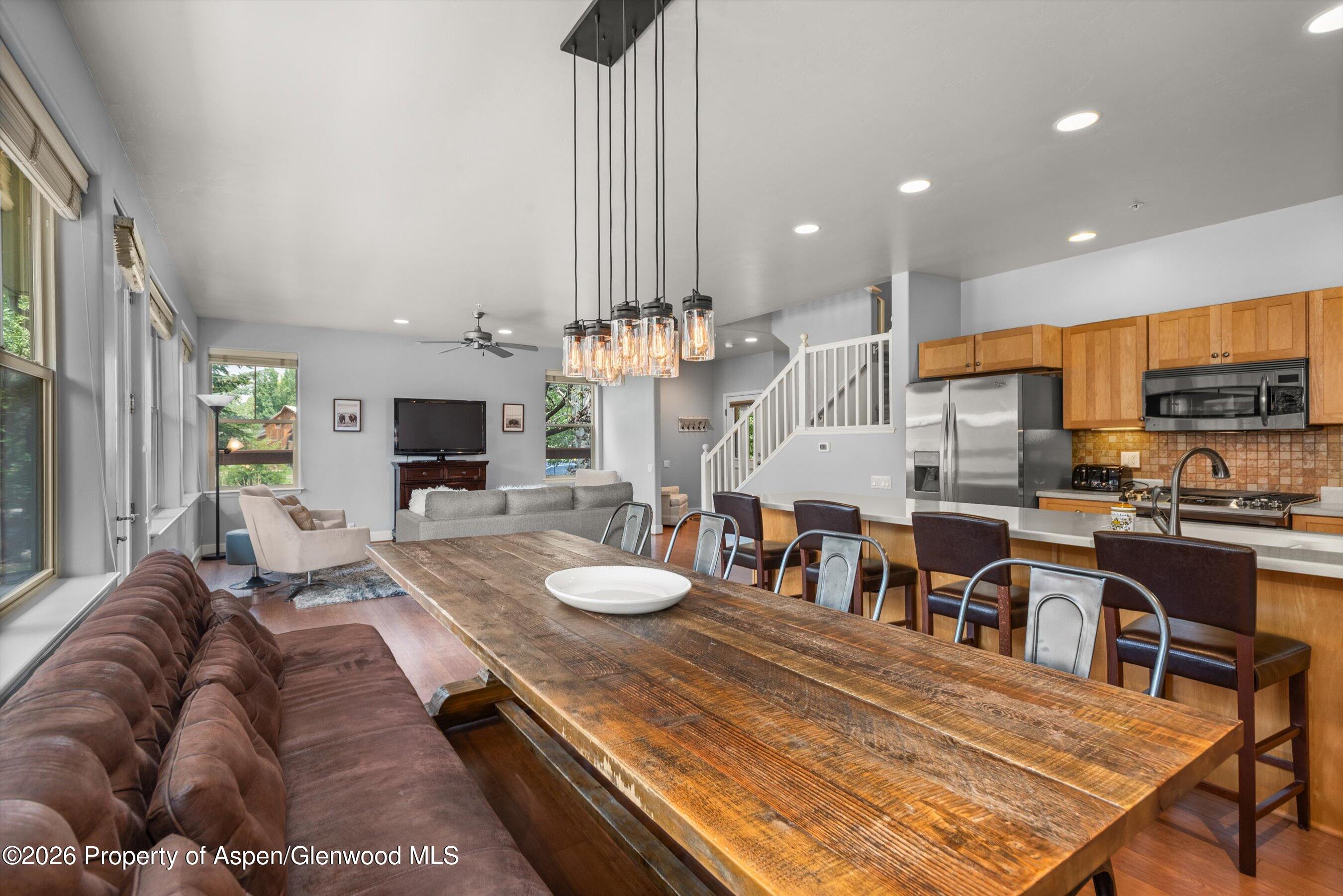 548 Evans Court Basalt, CO 81621 - Photo 8 of 36 a living room with stainless steel appliances furniture a rug and a kitchen view