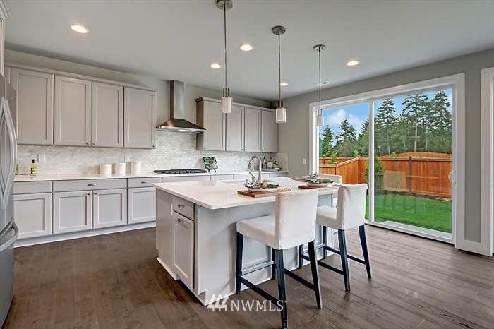 311 Field Place Southeast Renton, WA 98059 - Photo 6 of 8 a kitchen with a sink window and cabinets