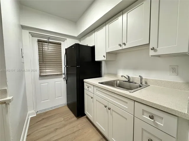 a kitchen with appliances and cabinets