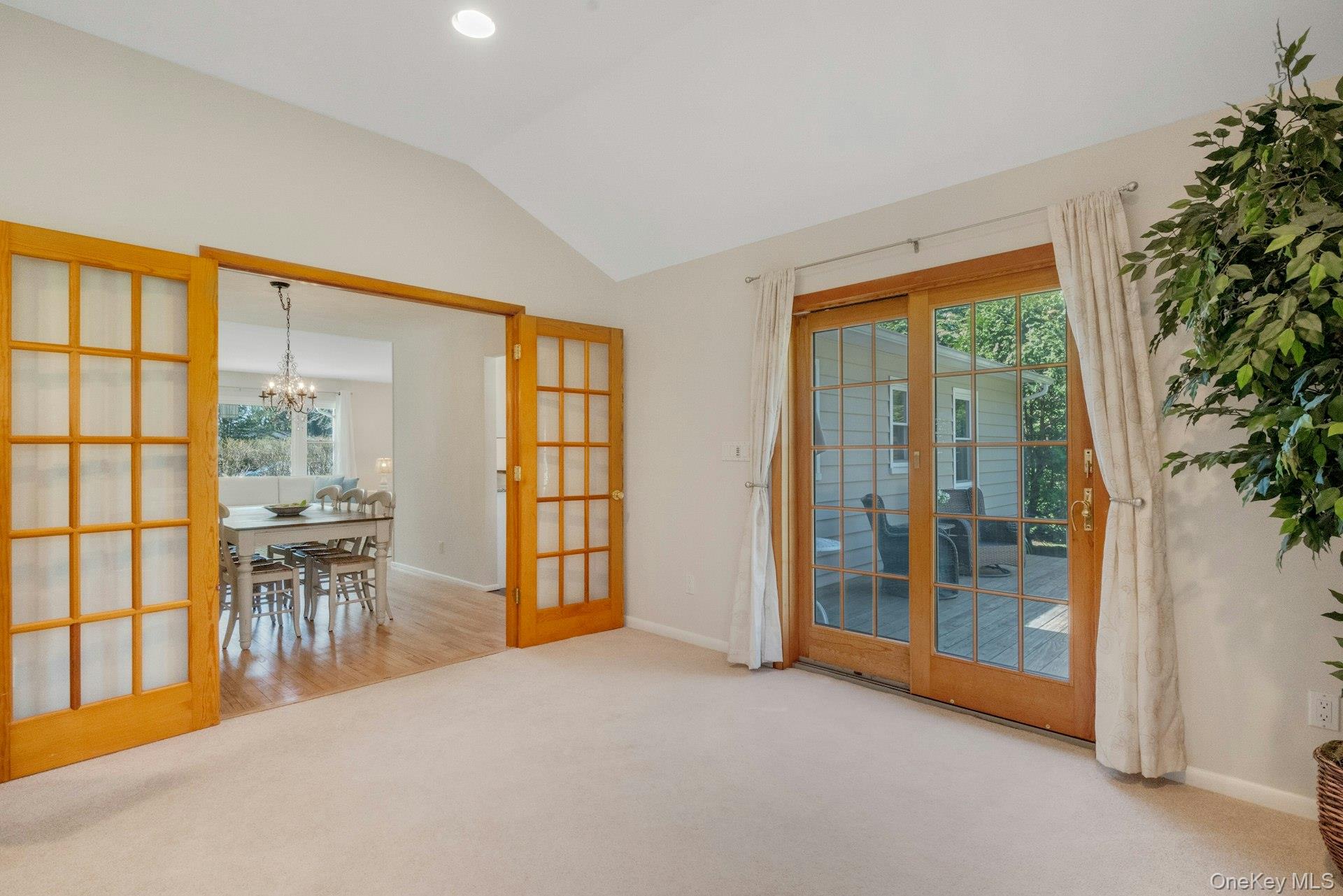 61 Schrade Road Briarcliff Manor, NY 10510 - Photo 15 of 39 View from Family Room looking through French doors to dining area and SGD to deck.
