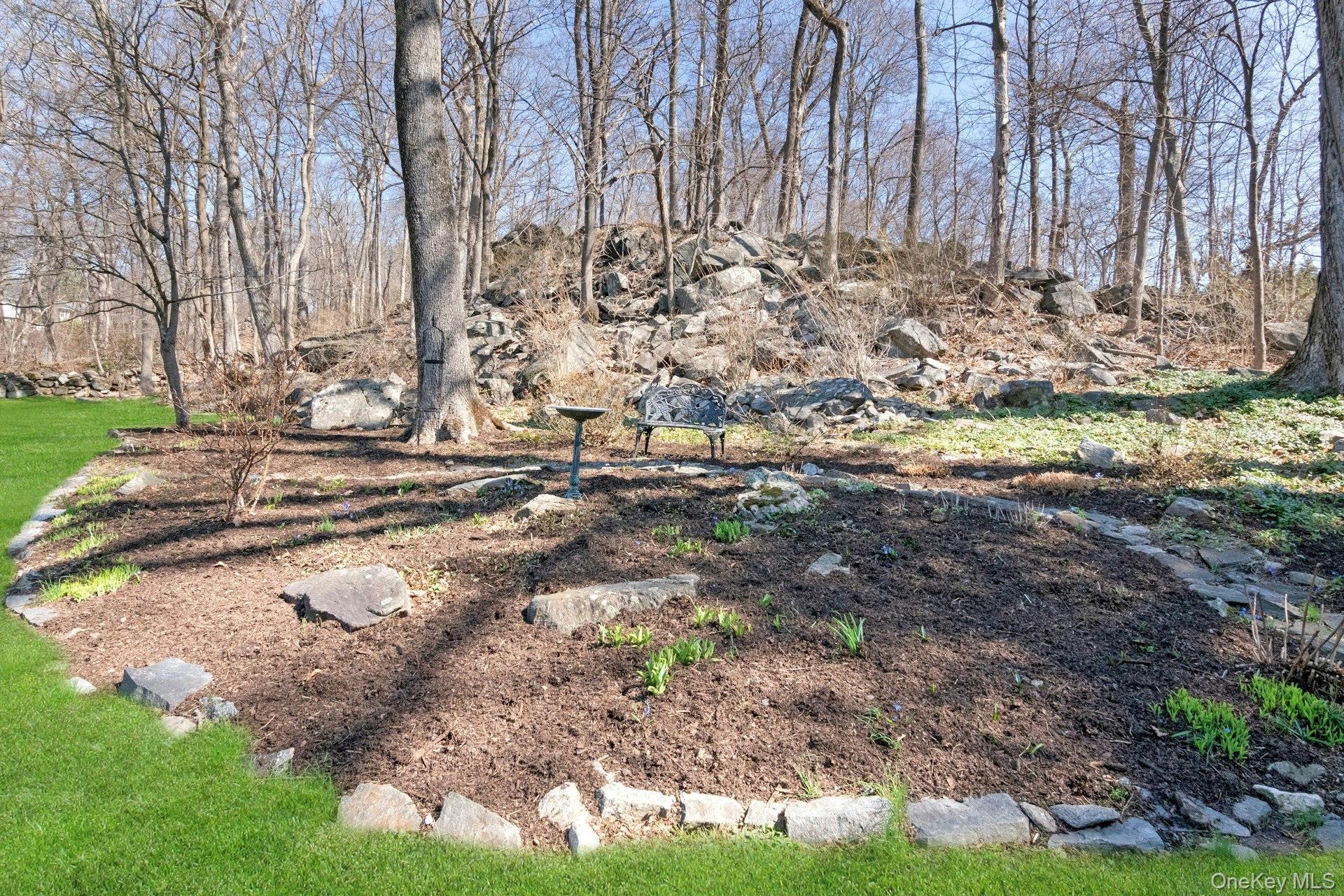 61 Schrade Road Briarcliff Manor, NY 10510 - Photo 30 of 39 Peaceful rock garden with bench and bird bath for quiet reflection.