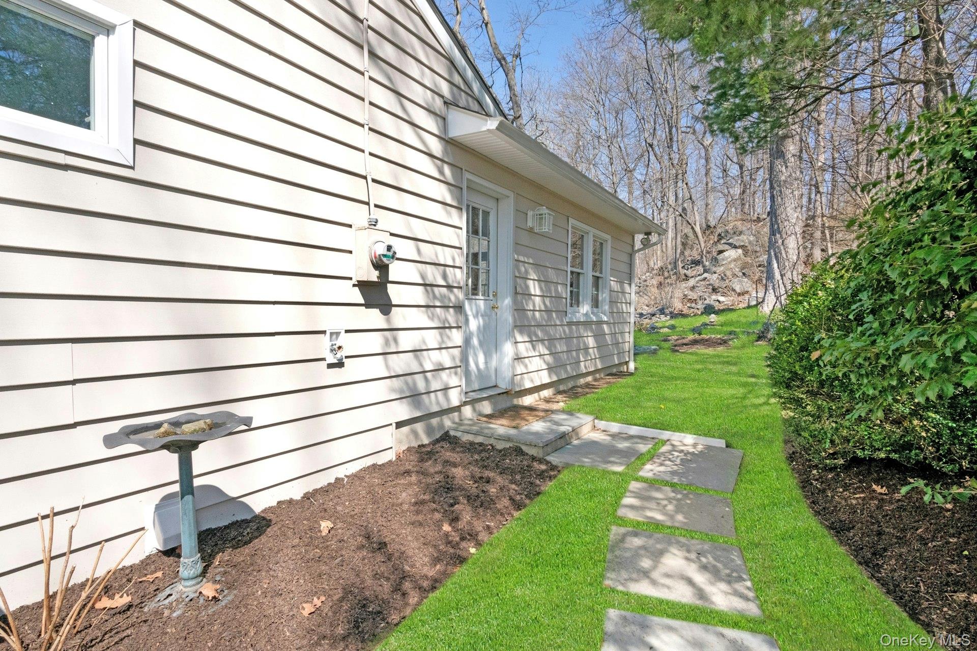 61 Schrade Road Briarcliff Manor, NY 10510 - Photo 34 of 39 Side path from Family room looking back towards rear of property.