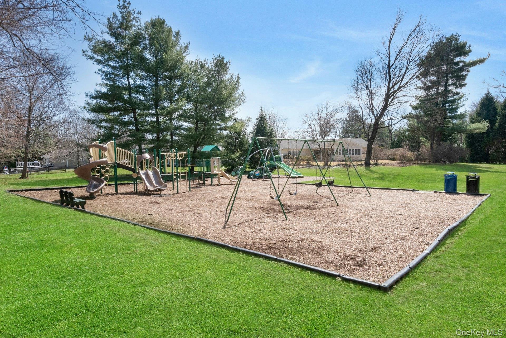 61 Schrade Road Briarcliff Manor, NY 10510 - Photo 37 of 39 Another view of the park playground equipment. So close to the house for playdate fun.