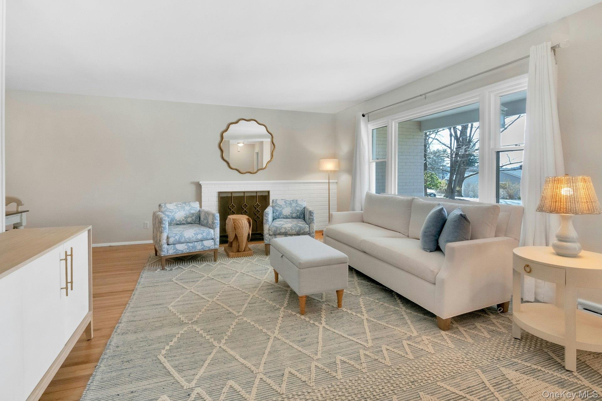 61 Schrade Road Briarcliff Manor, NY 10510 - Photo 4 of 39 Bright inviting picture window and brick fireplace anchor the spacious Living Room.