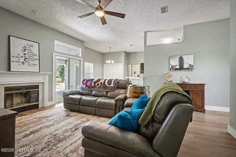 a living room with furniture and a fireplace