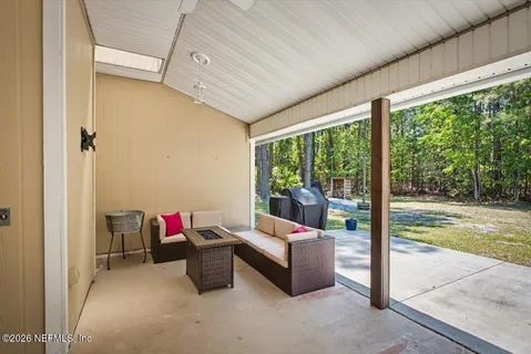 a living room with furniture and a window