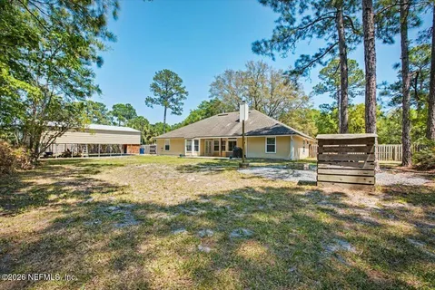 an aerial view of a house with a yard and garden