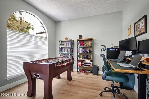 a view of a workspace with furniture and a workspace