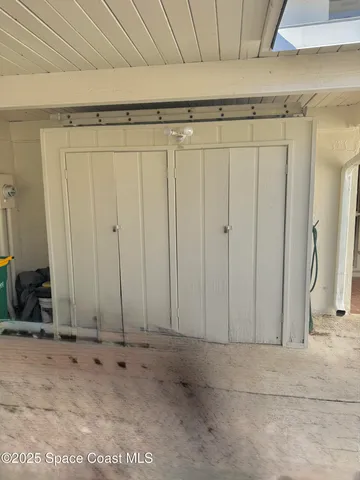 a view of a livingroom with furniture and a window