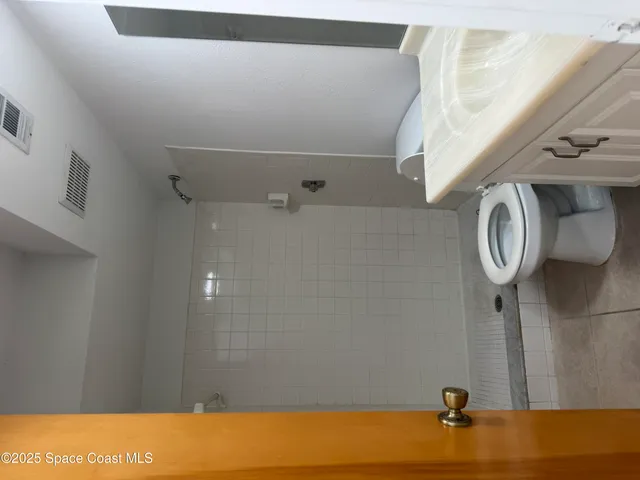 a kitchen with a sink appliances and cabinets