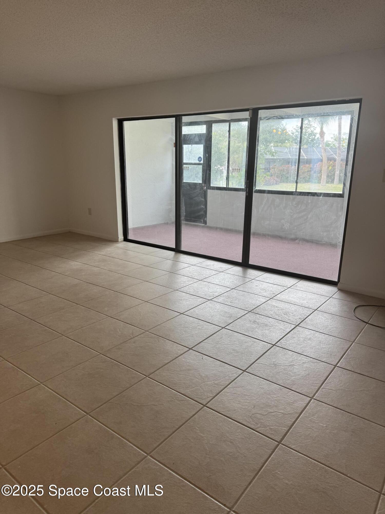 212 Augusta Way Melbourne, FL 32940 - Photo 26 of 49 a view of an empty room with a window
