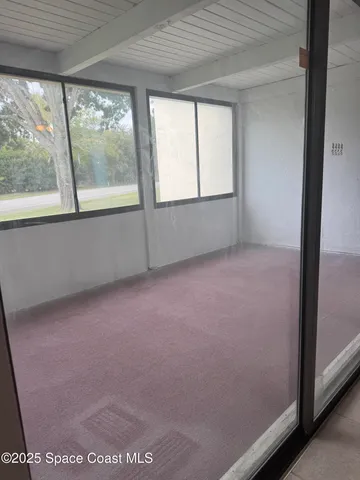 a kitchen with granite countertop a sink and cabinets