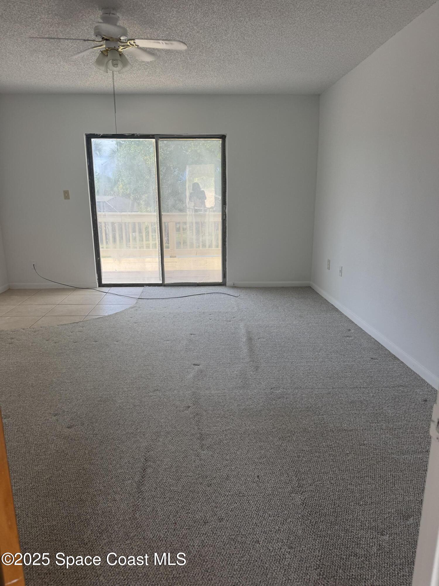 212 Augusta Way Melbourne, FL 32940 - Photo 44 of 49 an empty room with a window