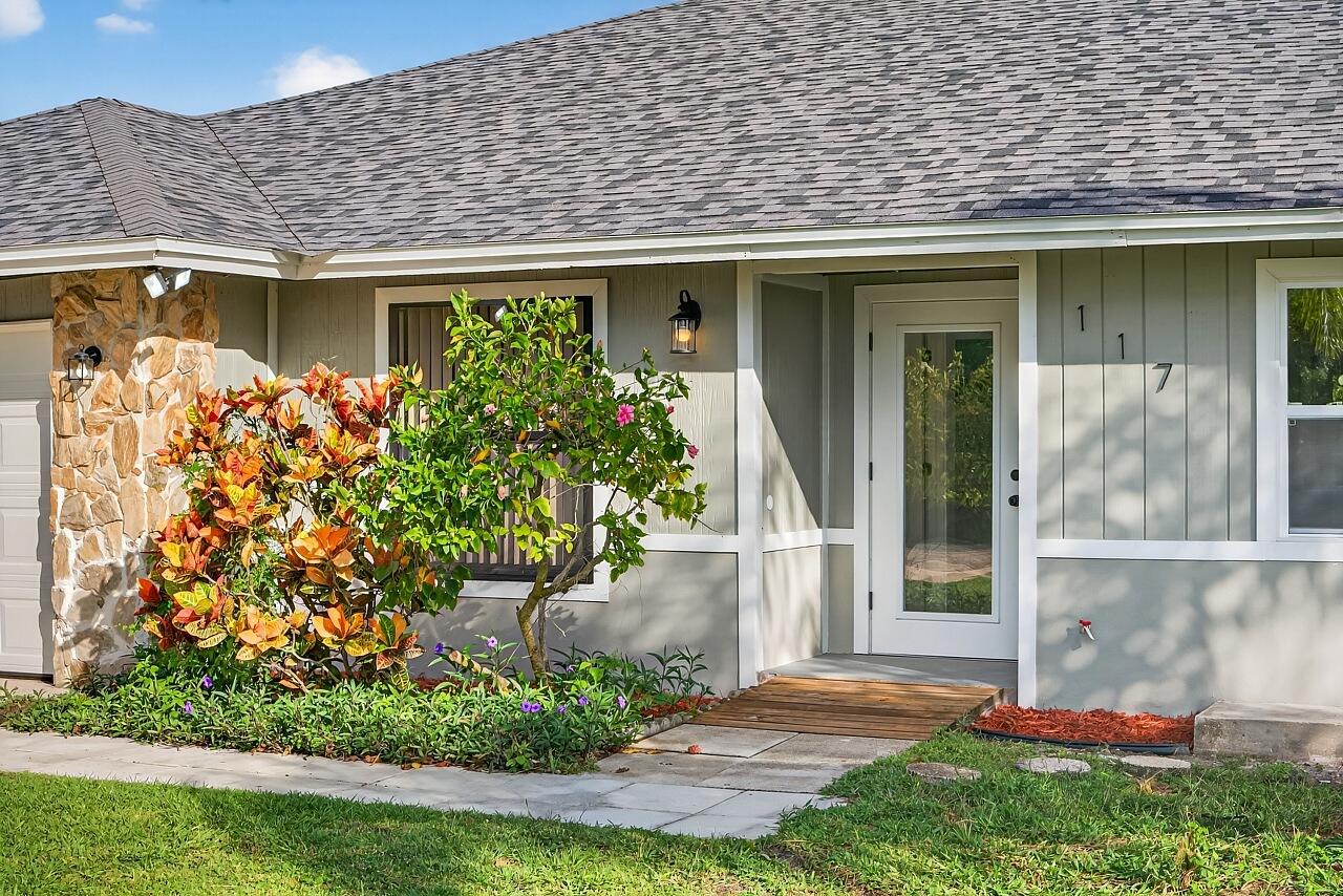 117 High Court Sebastian, FL 32958 - Photo 11 of 54 a front view of a house with garden
