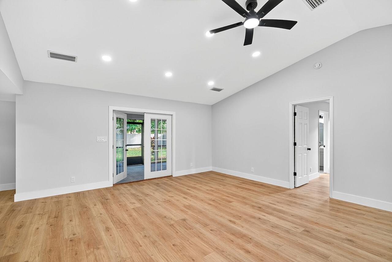 117 High Court Sebastian, FL 32958 - Photo 23 of 54 a view of an empty room with wooden floor and a window