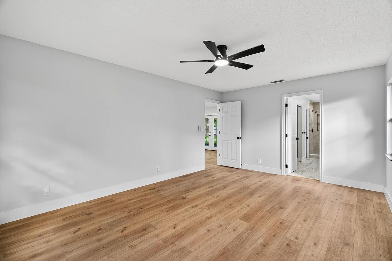 117 High Court Sebastian, FL 32958 - Photo 29 of 54 a view of empty room with wooden floor and fan