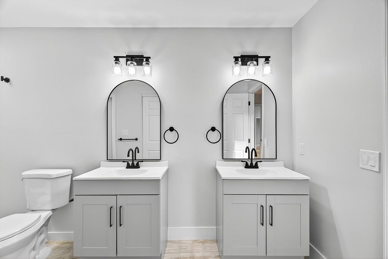 117 High Court Sebastian, FL 32958 - Photo 30 of 54 a bathroom with a double vanity sink and a toilet