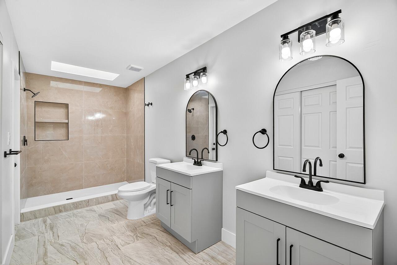 117 High Court Sebastian, FL 32958 - Photo 31 of 54 a bathroom with a sink and a mirror