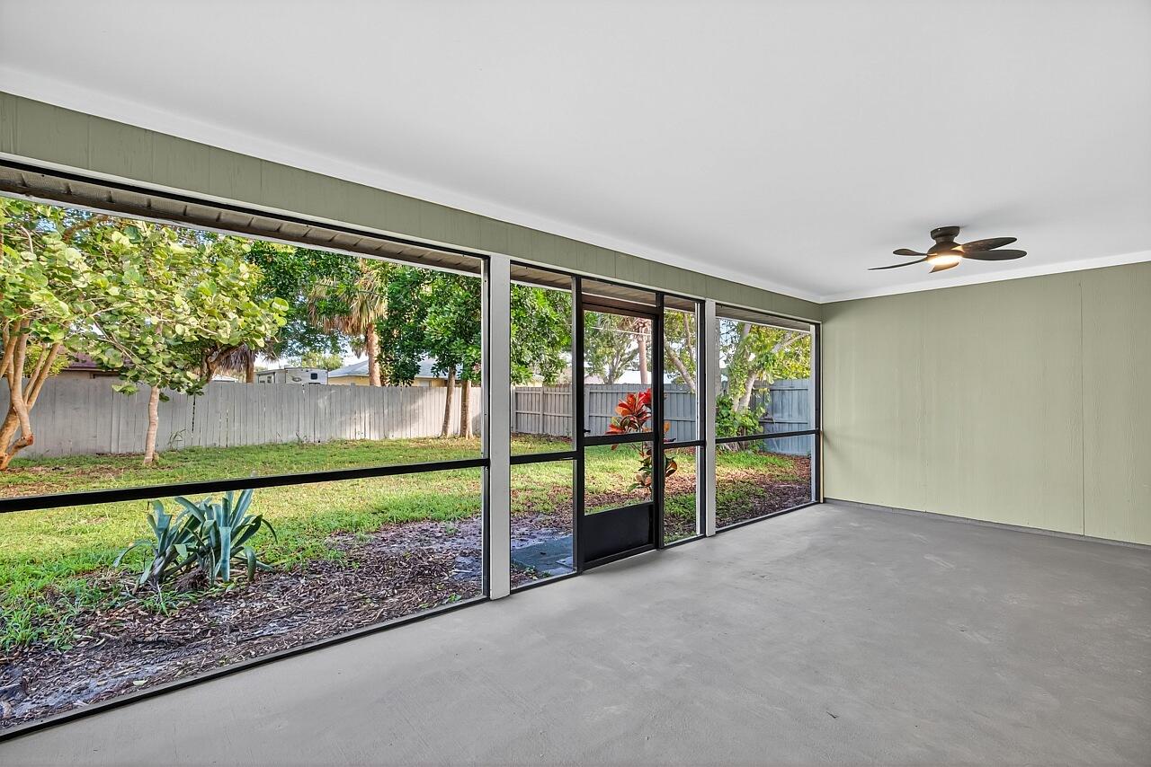 117 High Court Sebastian, FL 32958 - Photo 45 of 54 wooden floor in a room with a large window