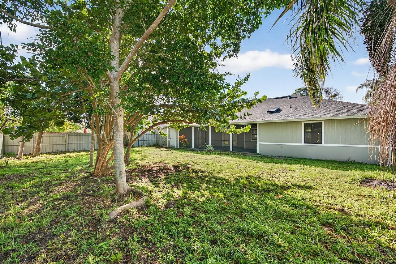 117 High Court Sebastian, FL 32958 - Photo 52 of 54 a front view of a house with garden