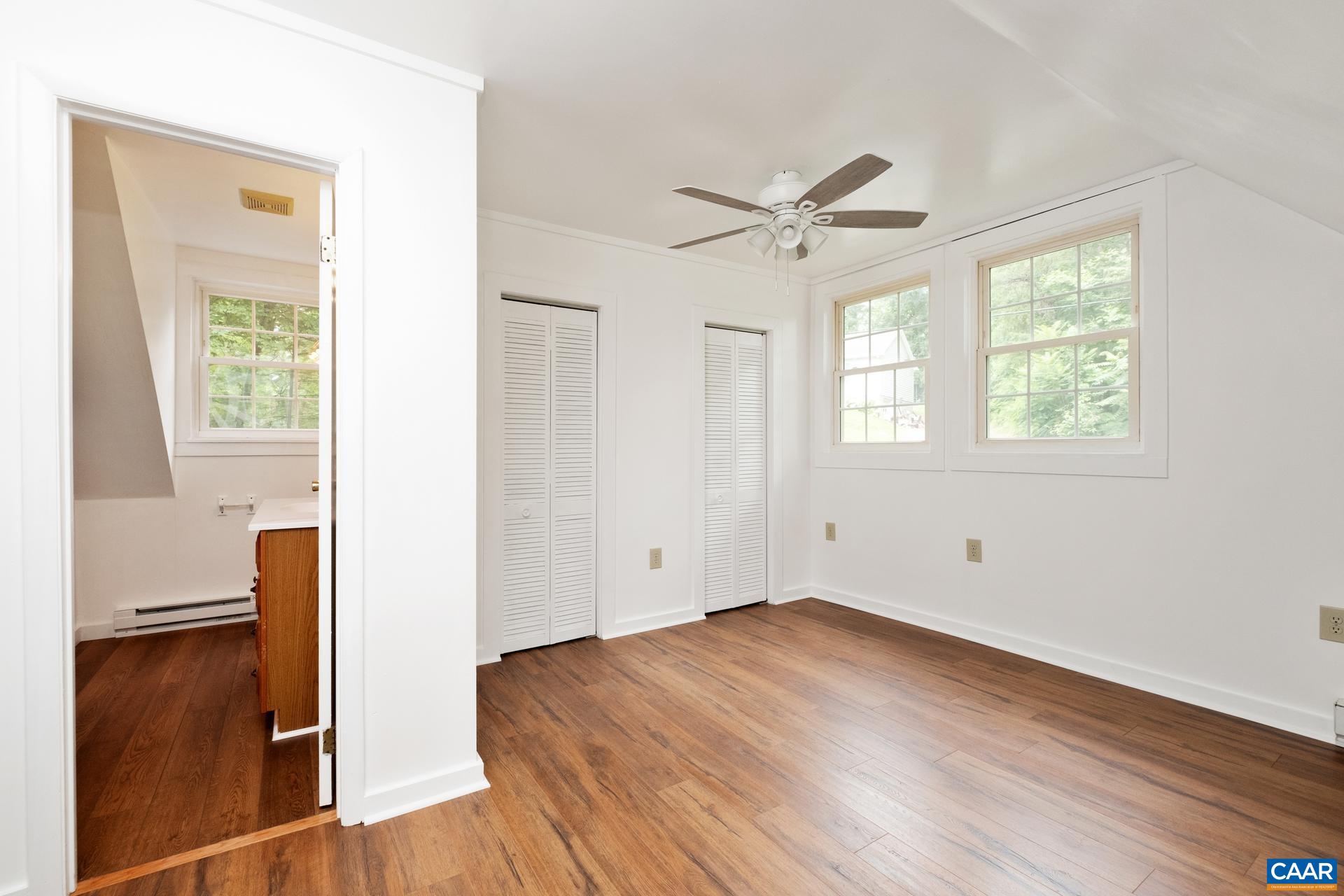 187 Logtrac Road Stanardsville, VA 22973 - Photo 15 of 19 a view of empty room with wooden floor and fan