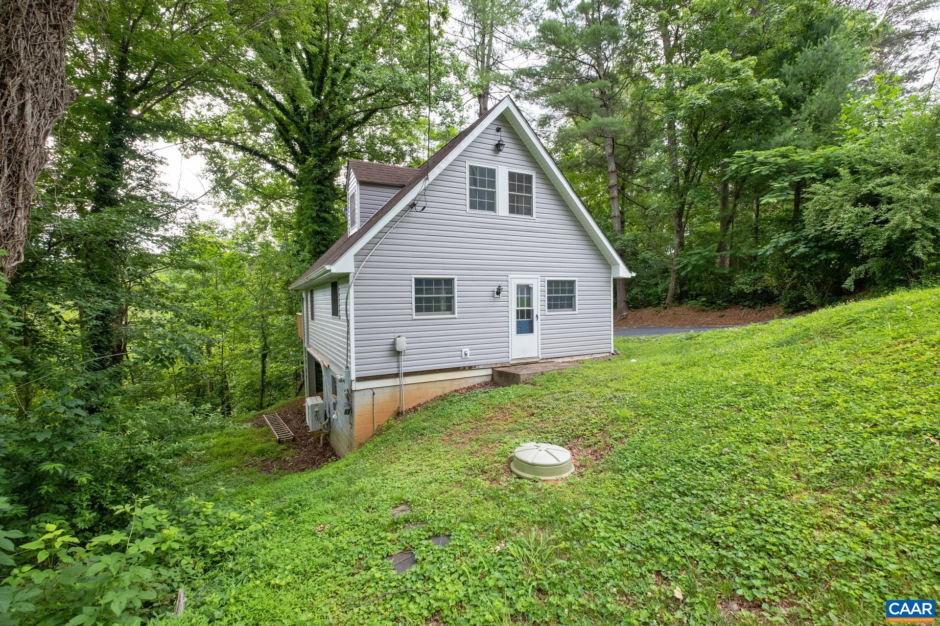187 Logtrac Road Stanardsville, VA 22973 - Photo 2 of 19 a view of a house with backyard and garden