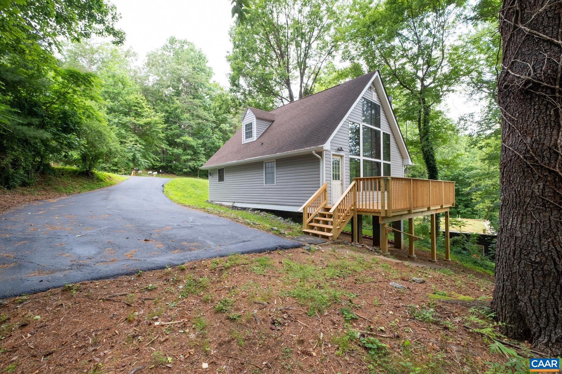 187 Logtrac Road Stanardsville, VA 22973 - Photo 3 of 19 a view of a house with backyard and a tree