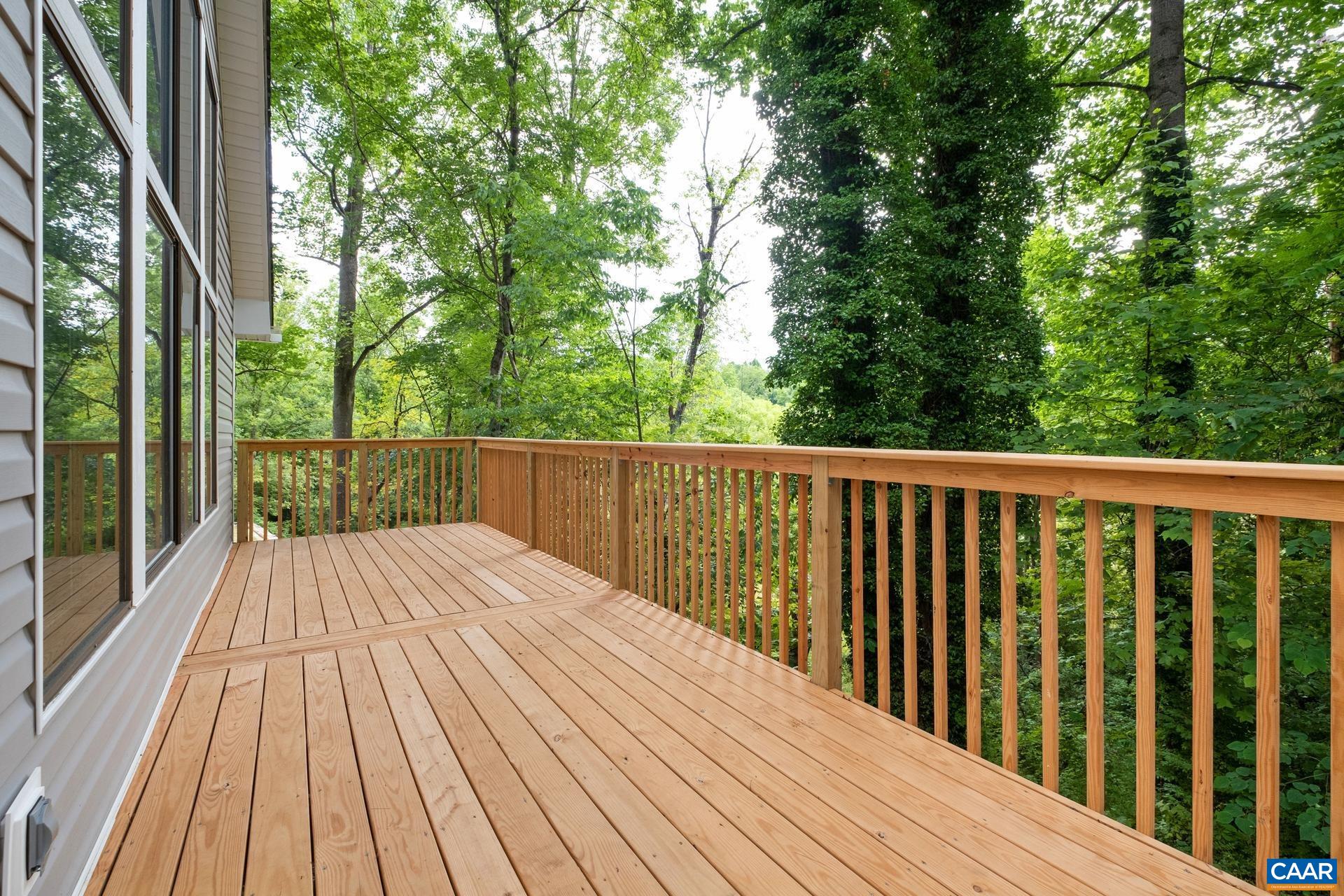 187 Logtrac Road Stanardsville, VA 22973 - Photo 4 of 19 a view of backyard with a deck and wooden floor