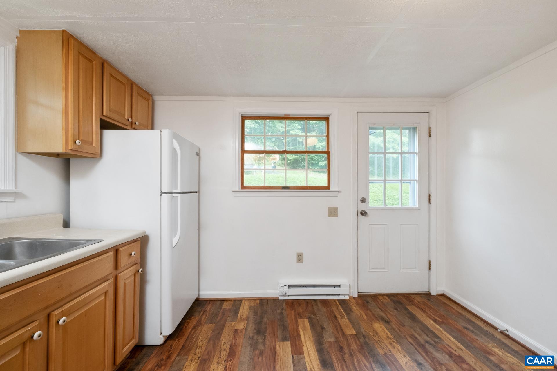187 Logtrac Road Stanardsville, VA 22973 - Photo 8 of 19 a view of a kitchen with wooden floor and a sink