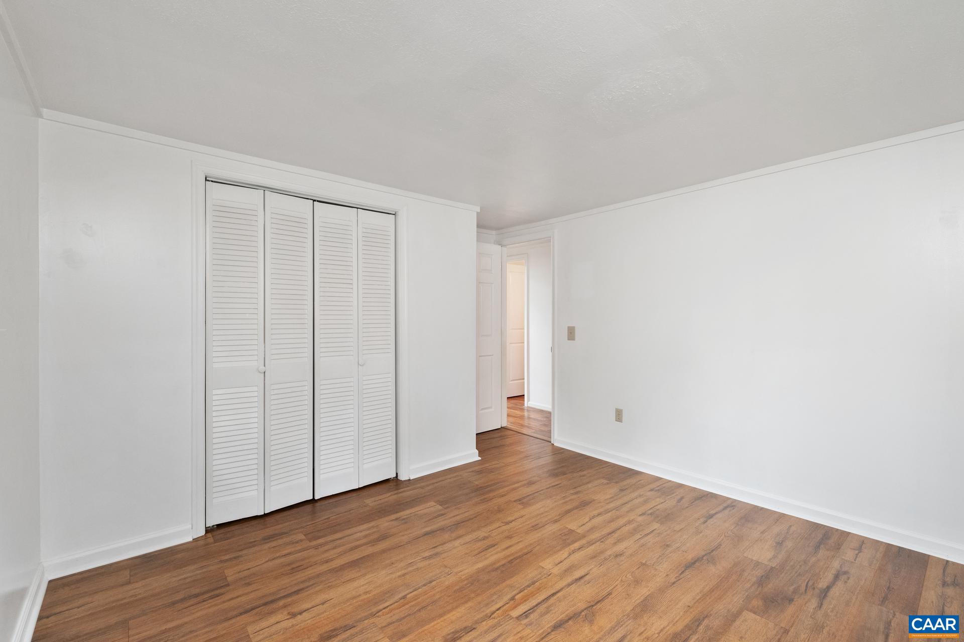 187 Logtrac Road Stanardsville, VA 22973 - Photo 10 of 19 a view of an empty room with wooden floor