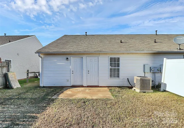 a view of a backyard of the house