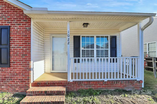 a view of a house with wooden deck