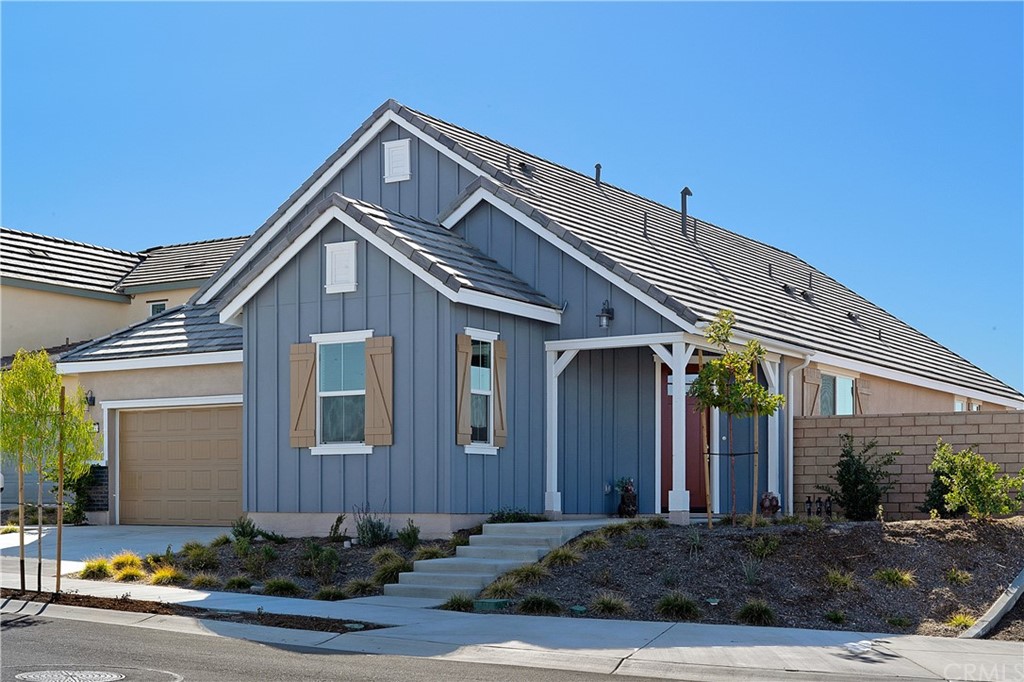 39833 Melic Way Temecula, CA 92591 - Photo 1 of 1 a front view of a house with garage and plants