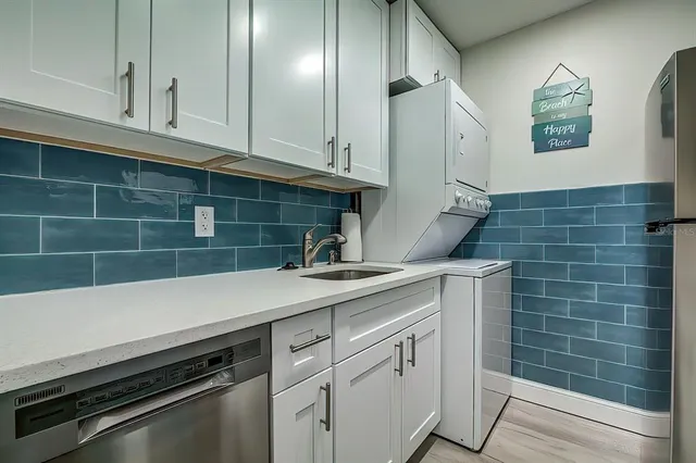 a kitchen with a sink and cabinets