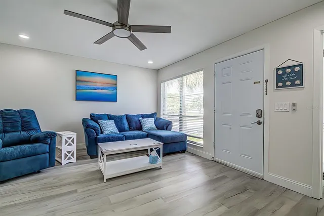 a living room with furniture and a window