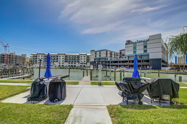 a view of a lake with a table and chairs