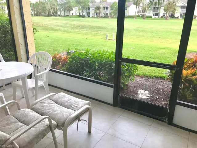 a view of a room with yard from a window