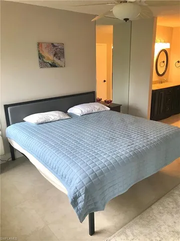 a view of a livingroom with wooden floor and window