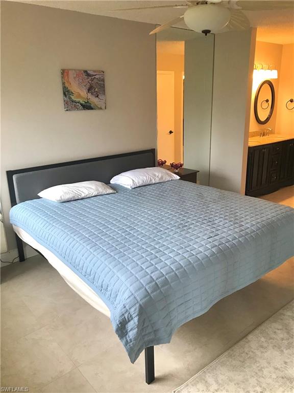 1085 Forest Lakes Drive, Unit 8106 Naples, FL 34105 - Photo 18 of 27 a view of a livingroom with wooden floor and window