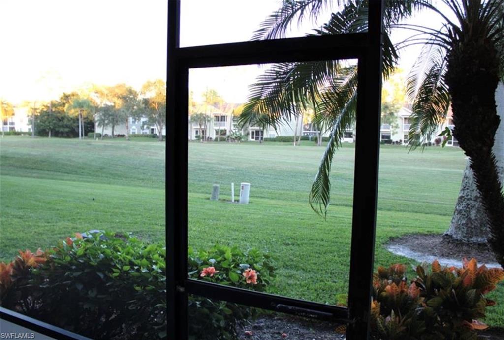 1085 Forest Lakes Drive, Unit 8106 Naples, FL 34105 - Photo 6 of 27 a view of yard from a window
