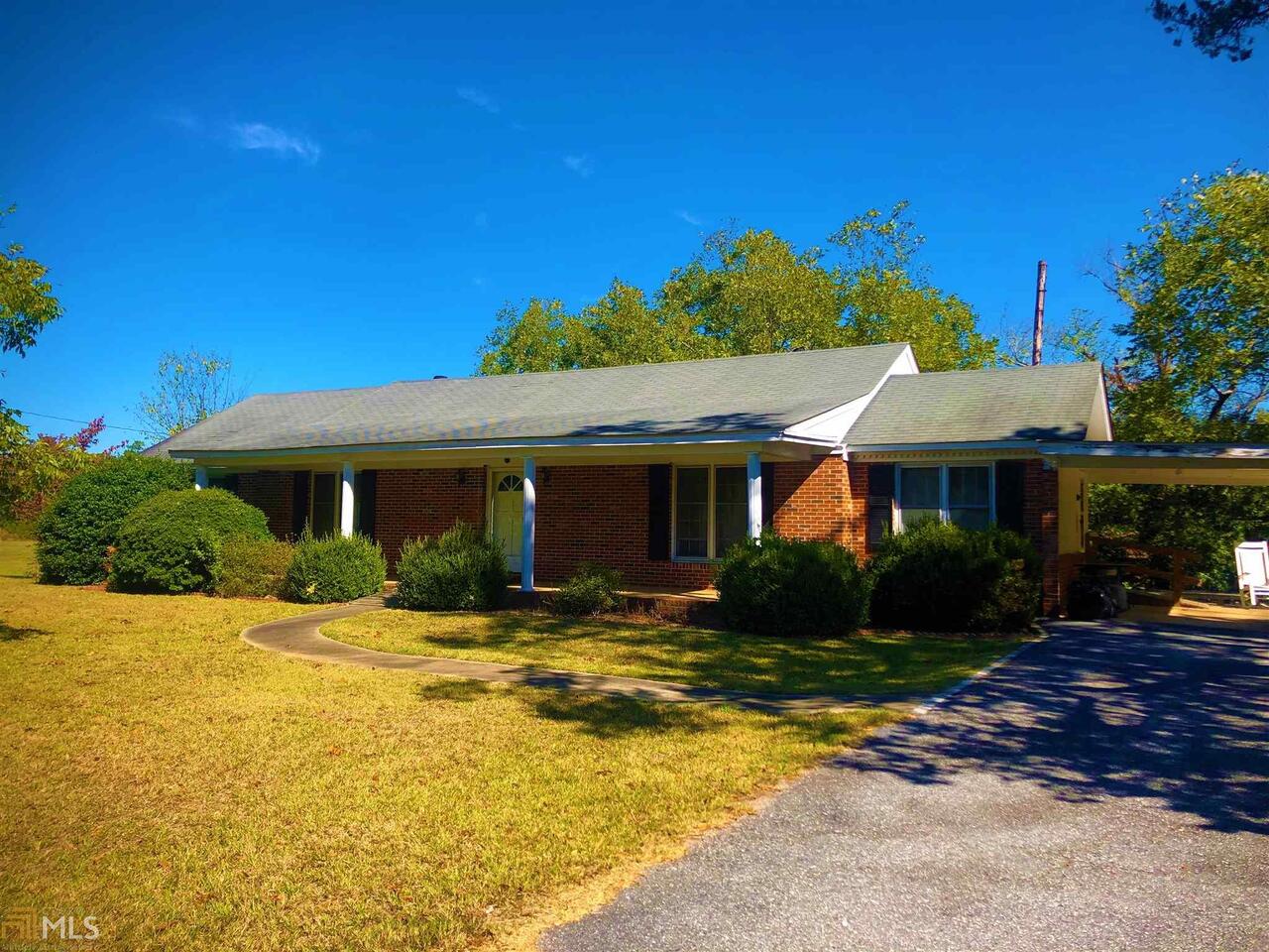 702 Athens Road Lexington, GA 30648 - Photo 1 of 1 a front view of a house with a yard