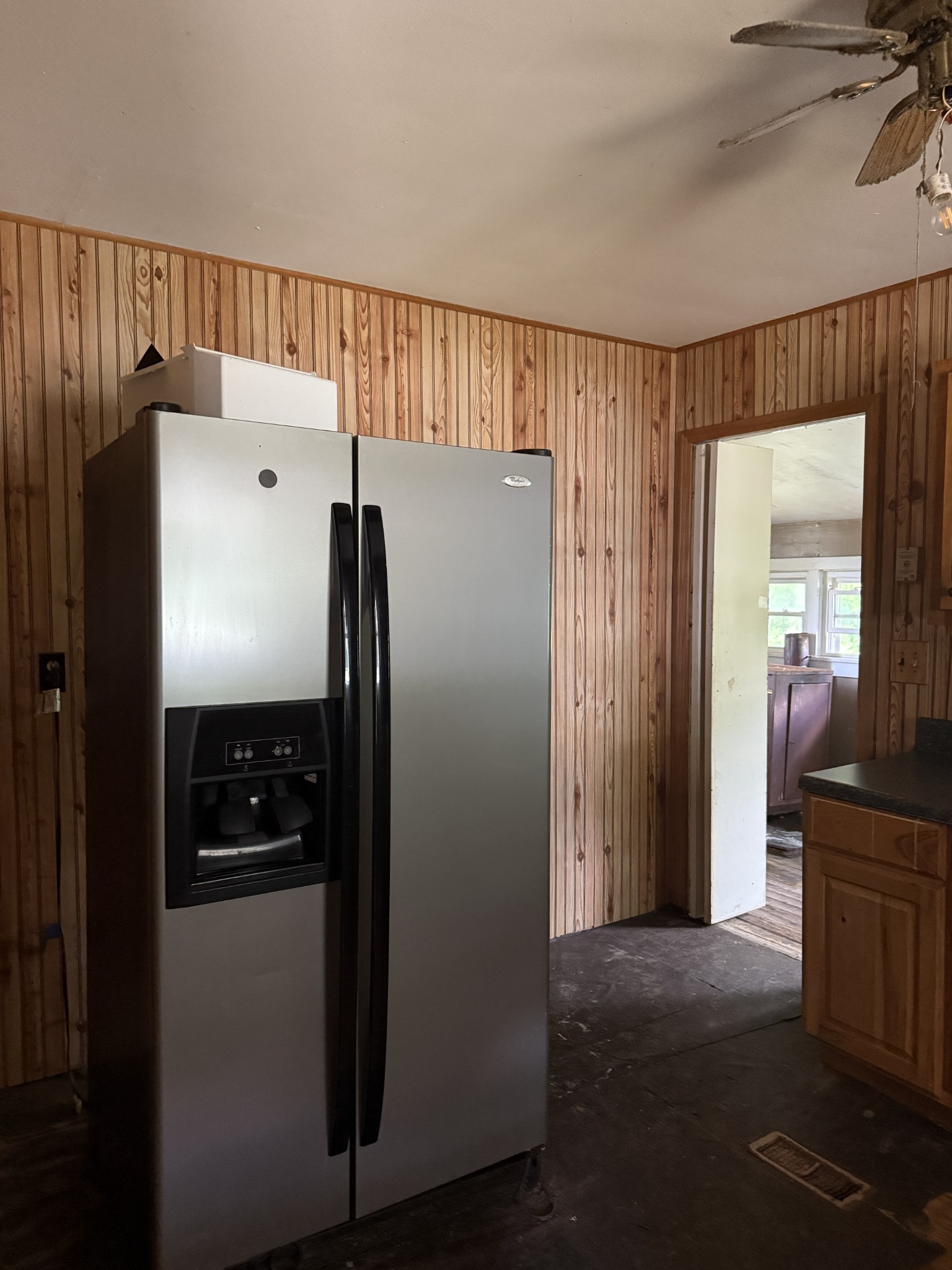 9843 Ed Lyell Road Lyles, TN 37098 - Photo 11 of 20 a view of a refrigerator in kitchen and a view of a living room