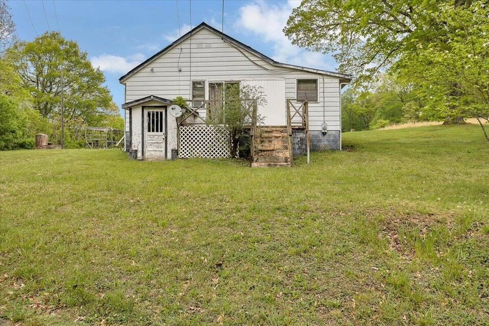 1038 Adelaide Lane Blue Ridge, VA 24064 - Photo 1 of 23 a view of a house with a yard and sitting area