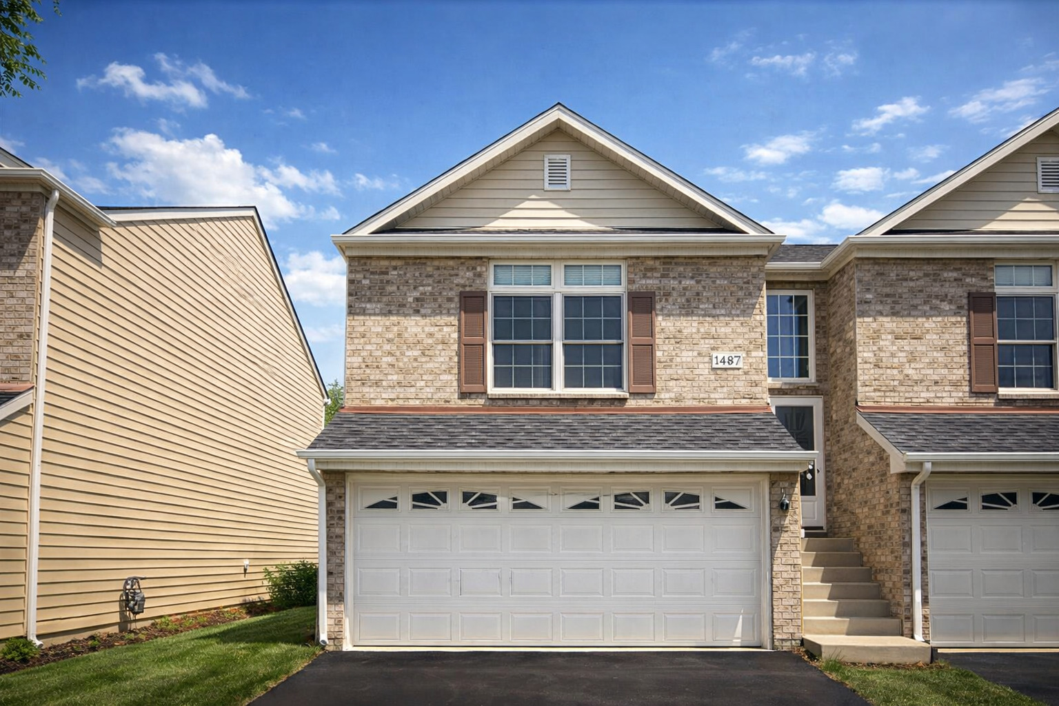 1497 Stonefield Drive DeKalb, IL 60115 - Photo 1 of 1 a large white building with a white roof